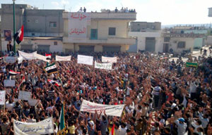 Manifestantes contra o presidente sírio Bashar al-Assad em Hula a 14 de Outubro de 2011